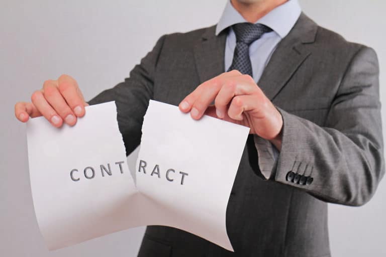 Businessman breaking contract close up